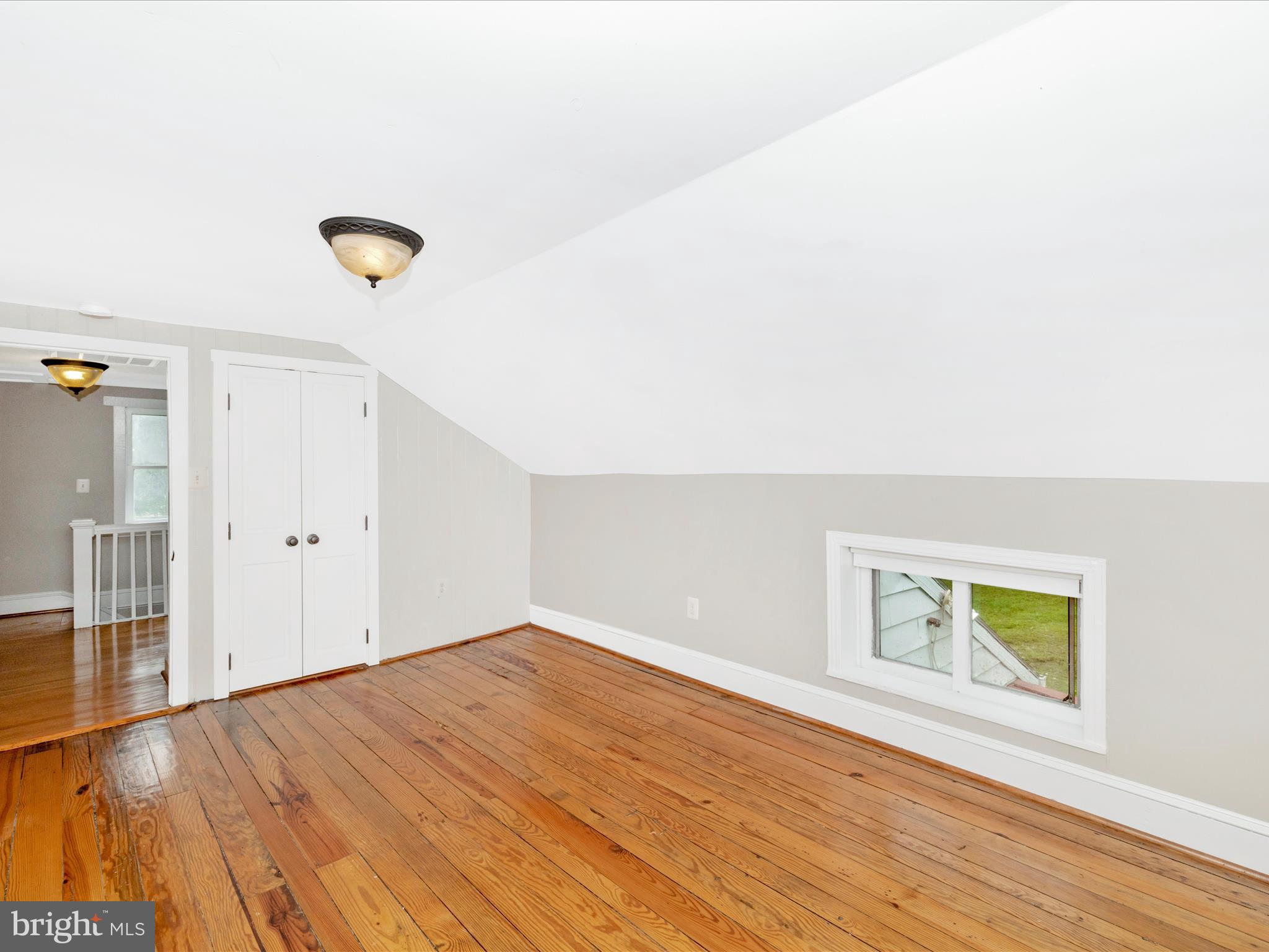 12261 Baugher Road Thurmont, MD 21788 - Photo 39 of 61 a view of empty room with wooden floor and fan