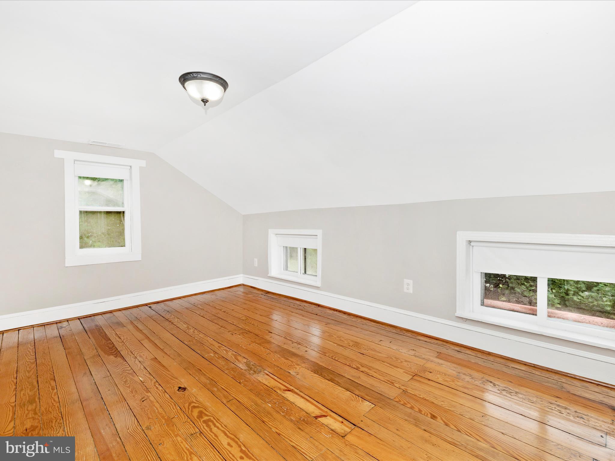 12261 Baugher Road Thurmont, MD 21788 - Photo 40 of 61 an empty room with wooden floor and windows