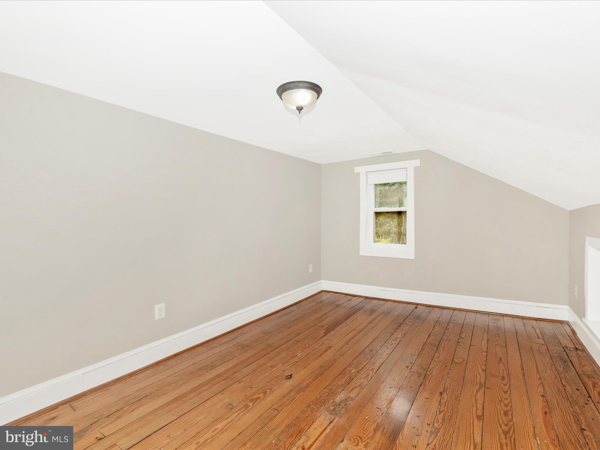 12261 Baugher Road Thurmont, MD 21788 - Photo 43 of 61 an empty room with wooden floor and windows