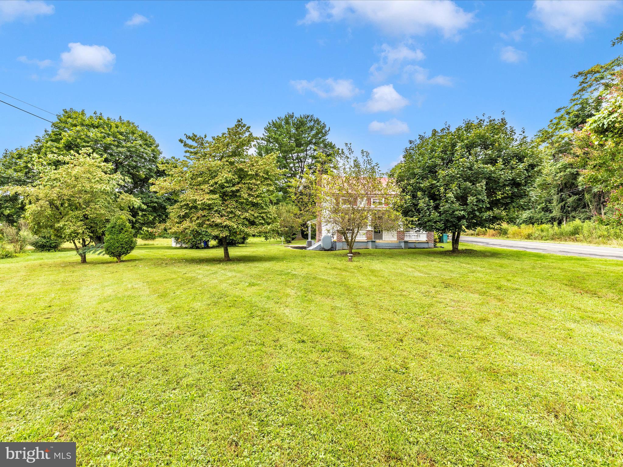 12261 Baugher Road Thurmont, MD 21788 - Photo 49 of 61 a view of swimming pool with outdoor space and trees in the background