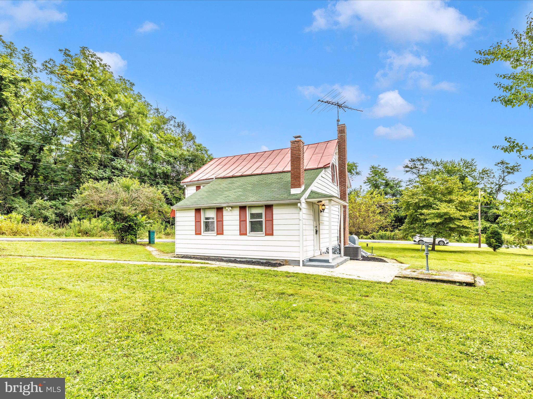 12261 Baugher Road Thurmont, MD 21788 - Photo 51 of 61 a house view with swimming pool and garden space