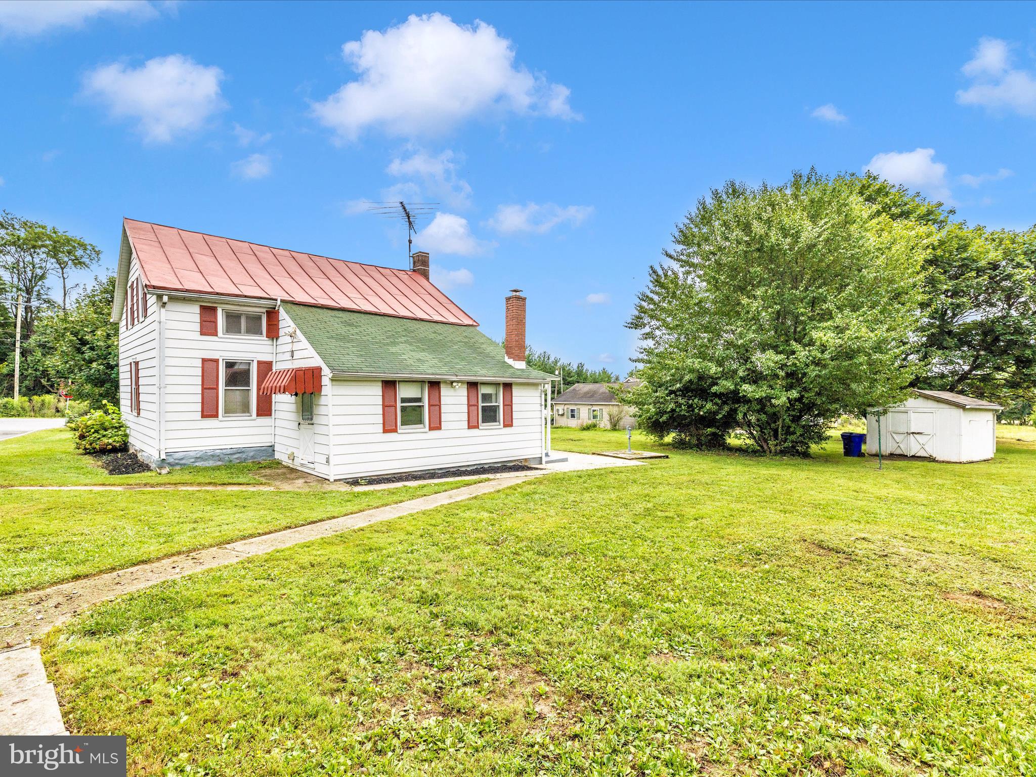 12261 Baugher Road Thurmont, MD 21788 - Photo 53 of 61 a front view of house with outdoor space and trees all around