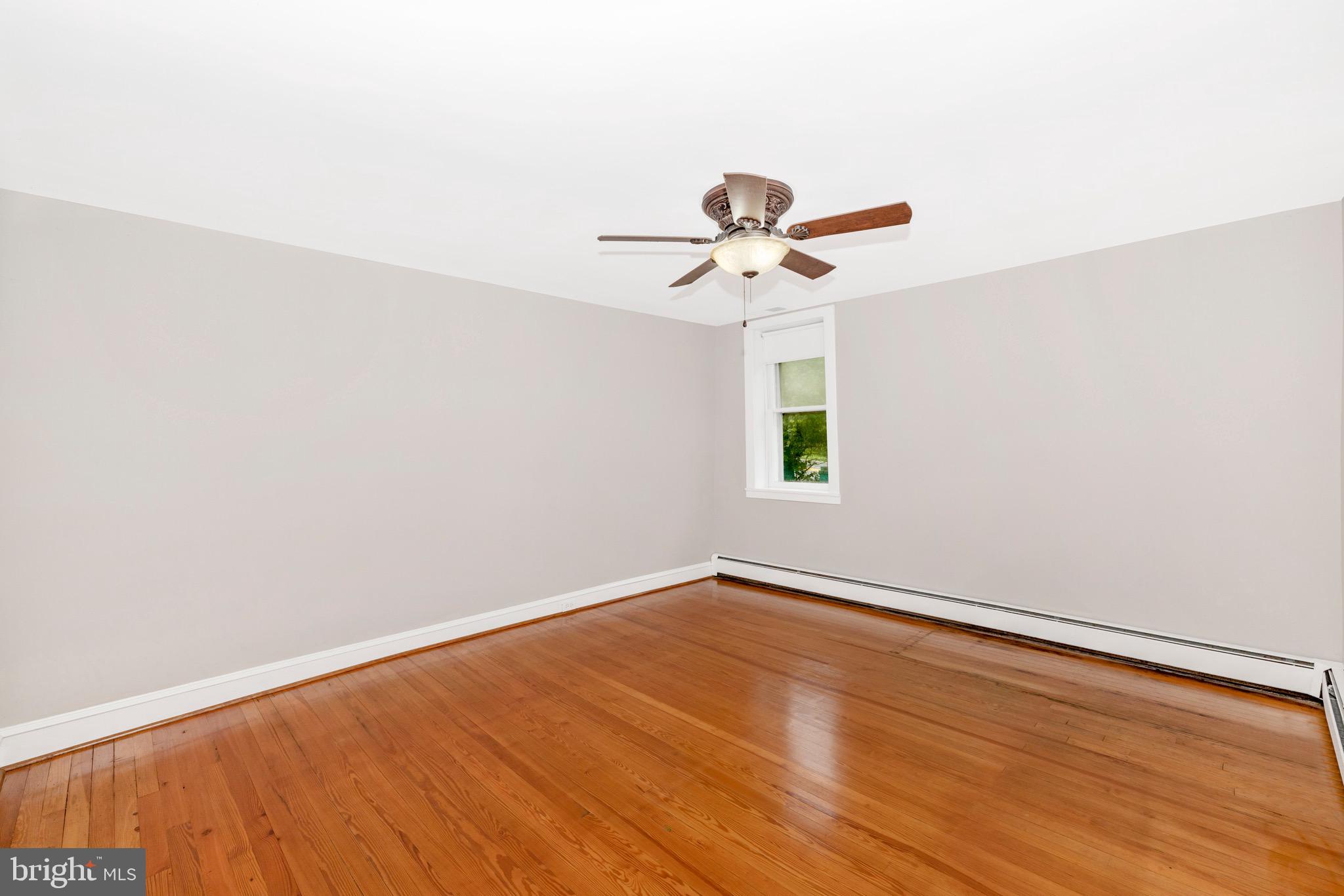 12261 Baugher Road Thurmont, MD 21788 - Photo 7 of 61 an empty room with a window and a fan