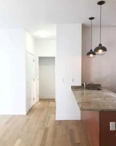 a view of a kitchen with a sink