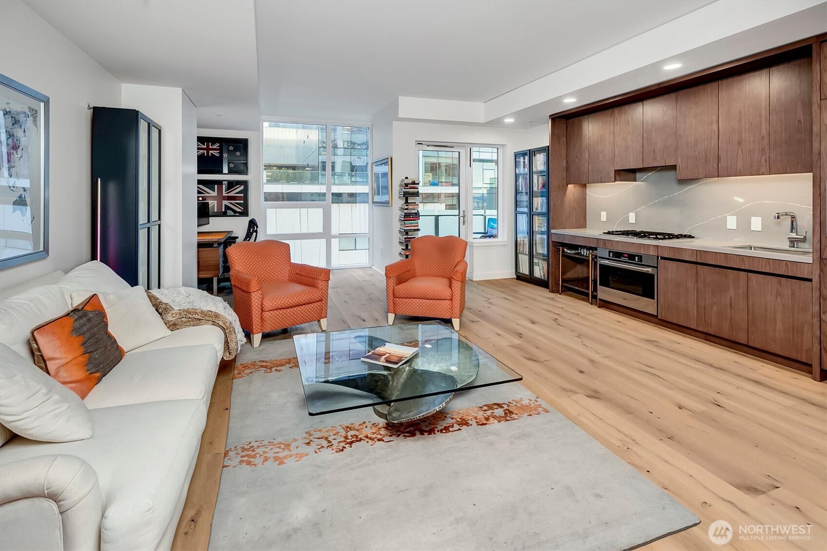 a living room with furniture fireplace and a window