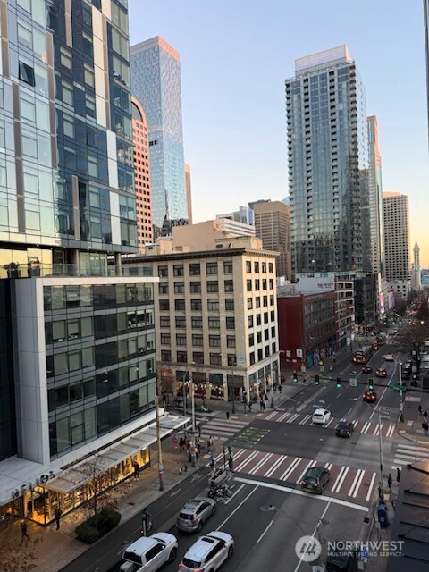 121 Stewart Street, Unit 504 Seattle, WA 98101 - Photo 13 of 27 a front view of a building with glass windows