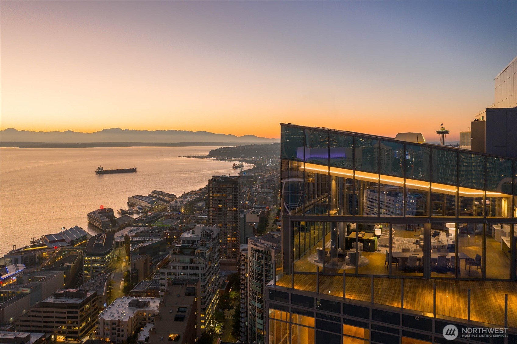 121 Stewart Street, Unit 504 Seattle, WA 98101 - Photo 2 of 27 a view of a lake with a city skyline