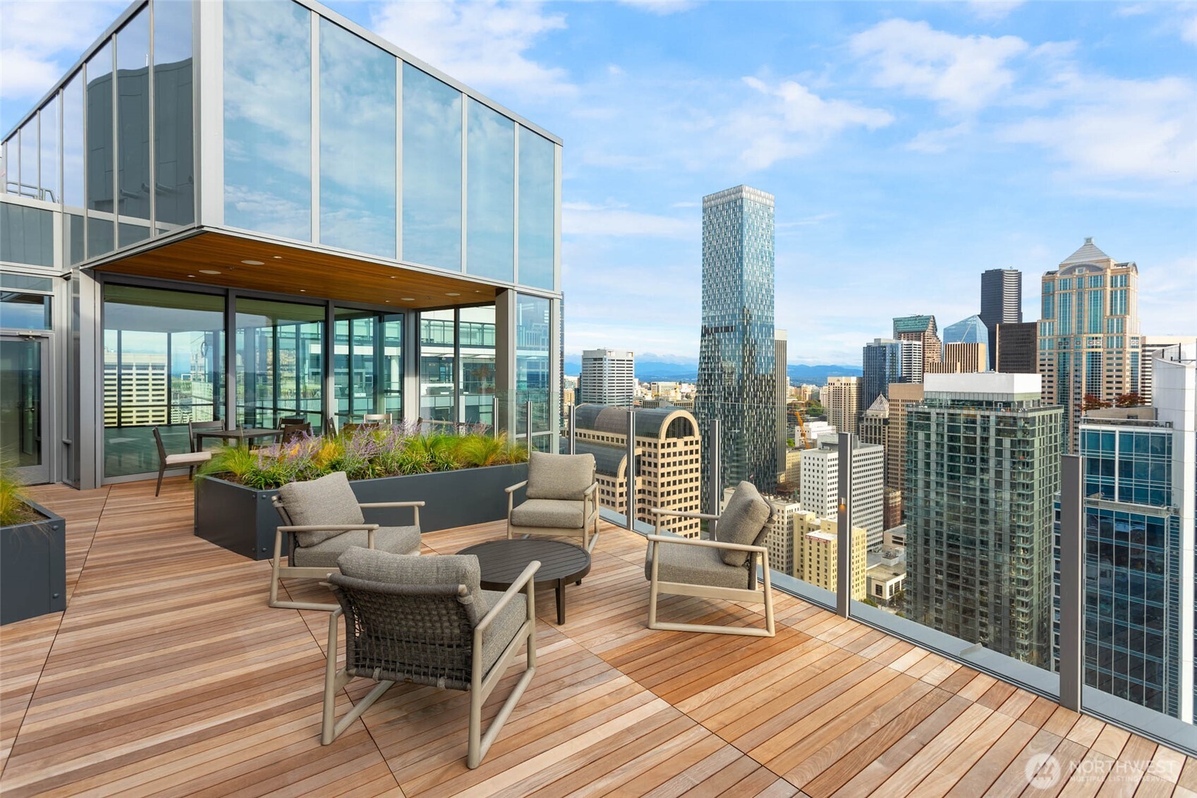 121 Stewart Street, Unit 504 Seattle, WA 98101 - Photo 22 of 27 a balcony with furniture and city view