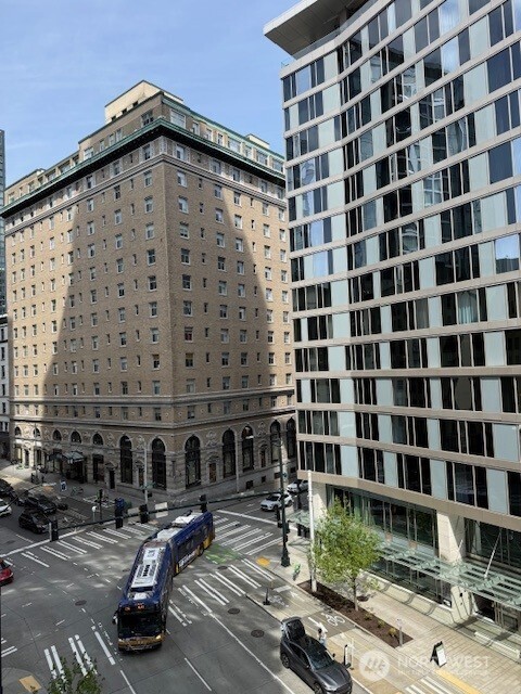 121 Stewart Street, Unit 504 Seattle, WA 98101 - Photo 26 of 27 a roof deck with glass door and outdoor space