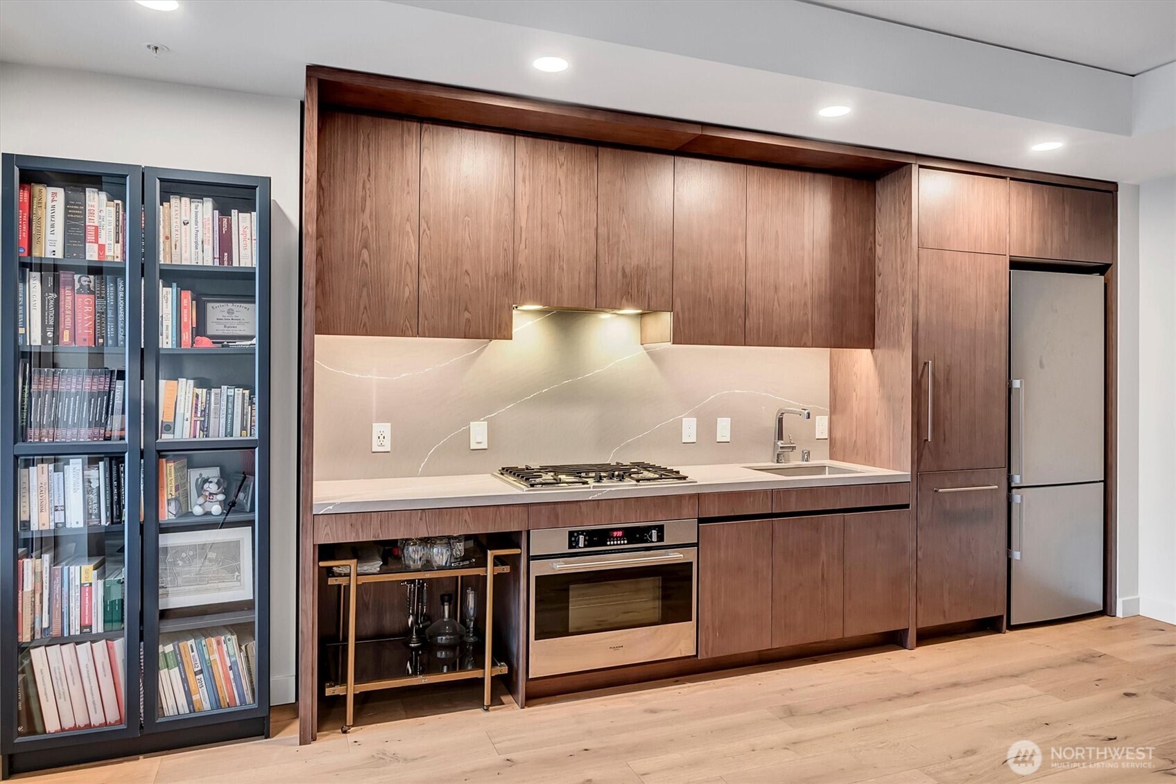 121 Stewart Street, Unit 504 Seattle, WA 98101 - Photo 9 of 27 a kitchen with stainless steel appliances granite countertop a stove and a refrigerator