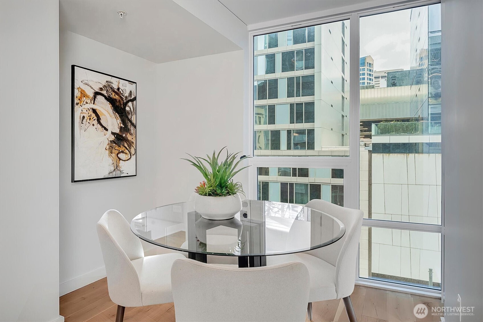 121 Stewart Street, Unit 504 Seattle, WA 98101 - Photo 10 of 27 a dining room with furniture and window