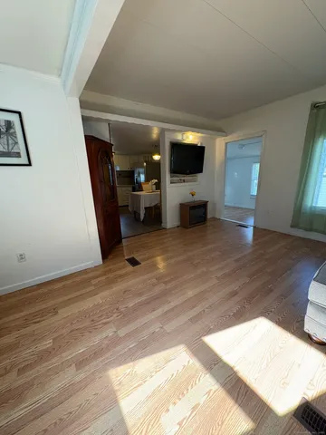 a view of livingroom with furniture and wooden floor