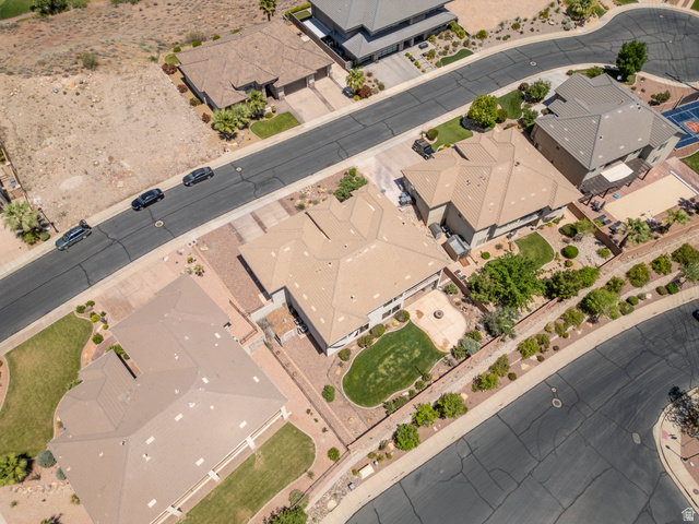 2005 West 450 S Circle St. George, UT 84770 - Photo 49 of 57 Aerial perspective showcasing a residential property with a landscaped backyard