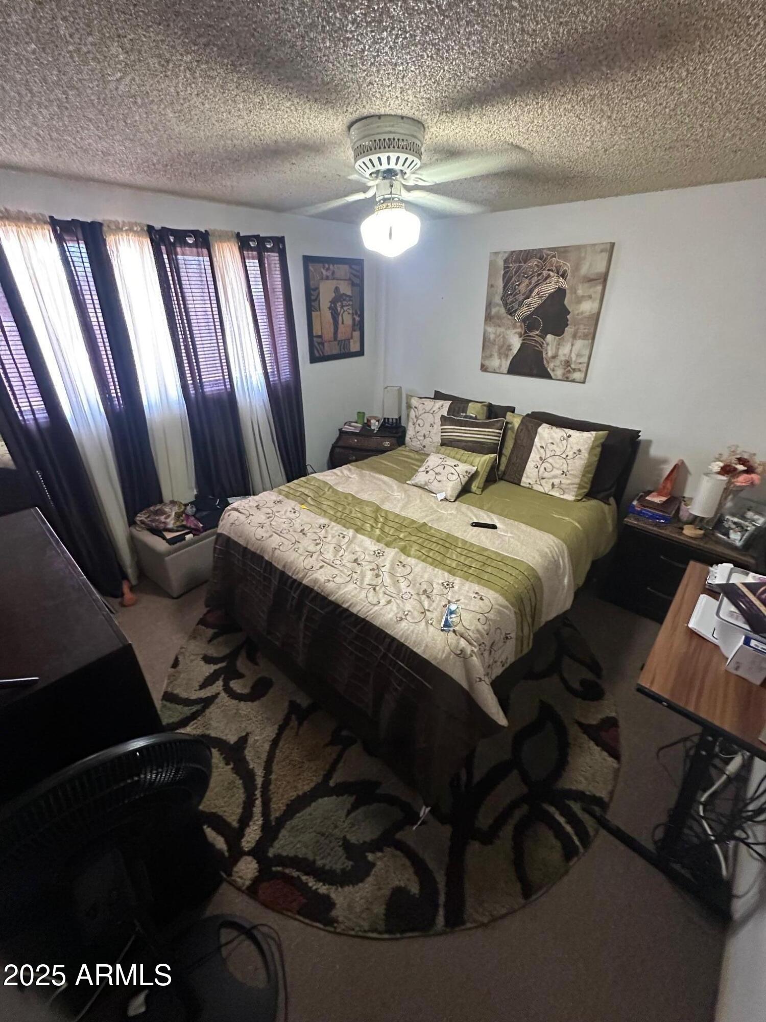 1145 West Southern Avenue Tempe, AZ 85282 - Photo 12 of 13 a bed sitting in a bedroom next to a window