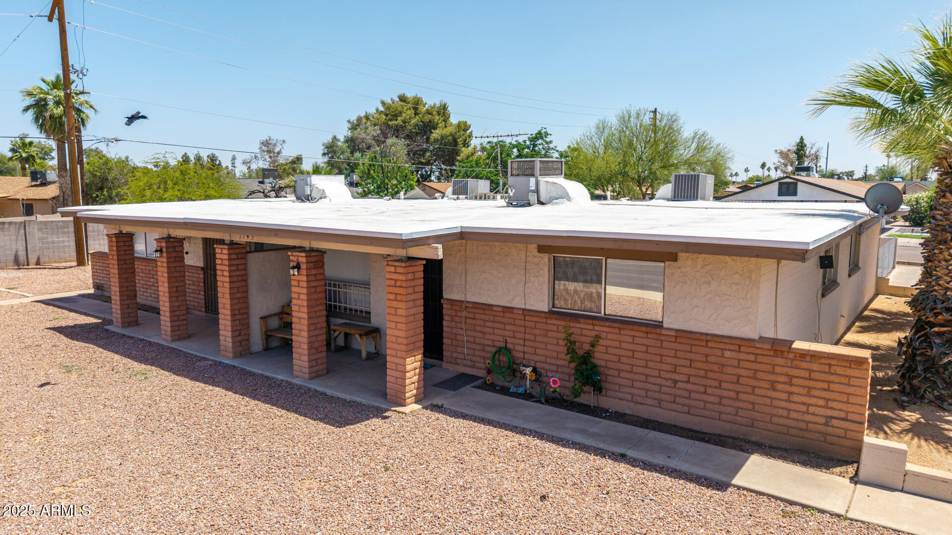 1145 West Southern Avenue Tempe, AZ 85282 - Photo 2 of 13 a view of a house with a balcony and yard