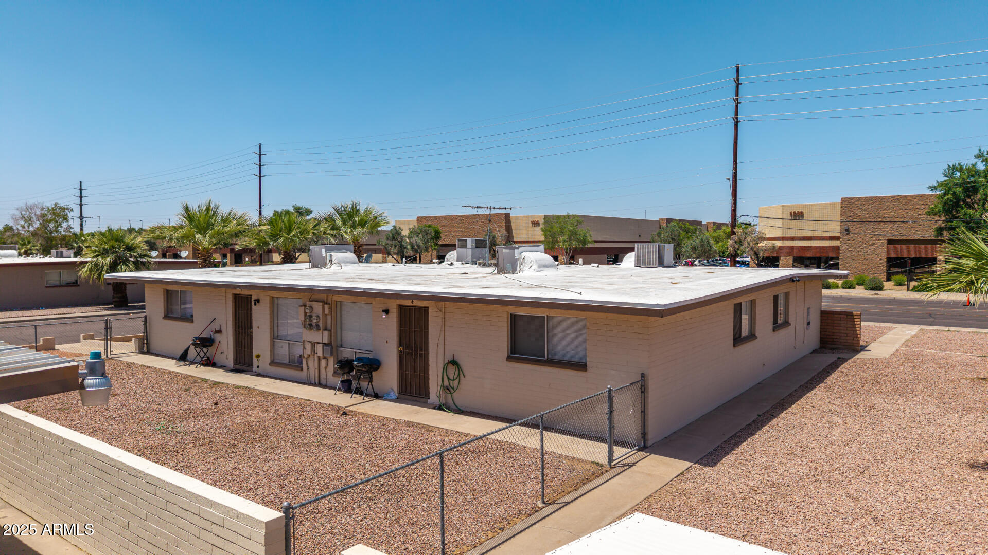 1145 West Southern Avenue Tempe, AZ 85282 - Photo 3 of 13 a view of a kitchen with a sink and stove