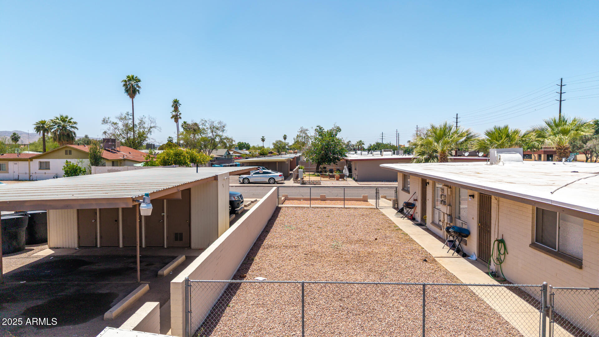 1145 West Southern Avenue Tempe, AZ 85282 - Photo 4 of 13 a balcony with wooden floor and outdoor seating