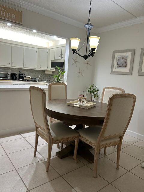 825 Sky Pine Way, Unit C1 Greenacres, FL 33415 - Photo 11 of 18 a view of a dining room with furniture