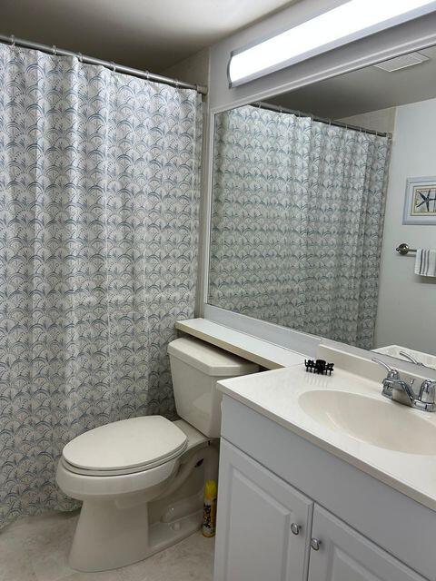 825 Sky Pine Way, Unit C1 Greenacres, FL 33415 - Photo 14 of 18 a bathroom with a sink a toilet and shower curtain