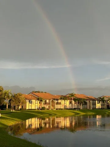 a view of swimming pool and an outdoor seating