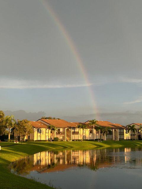 825 Sky Pine Way, Unit C1 Greenacres, FL 33415 - Photo 18 of 18 a view of swimming pool and an outdoor seating