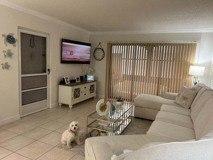 825 Sky Pine Way, Unit C1 Greenacres, FL 33415 - Photo 7 of 18 a living room with furniture and a window