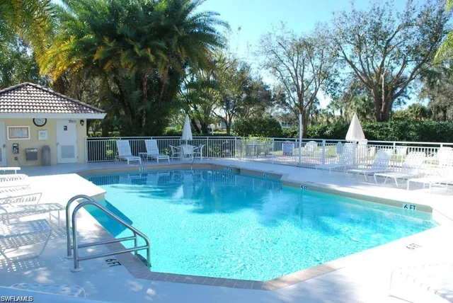 a view of a swimming pool with a patio