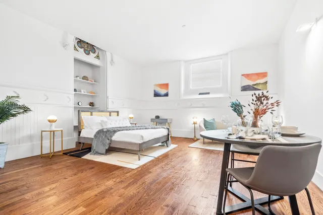 a living room with furniture and a table
