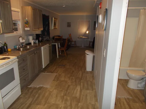 a kitchen with a sink and a stove top oven