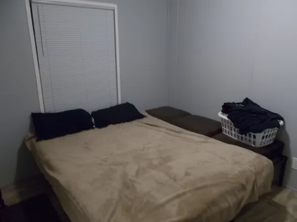 a bedroom with a bed and a closet