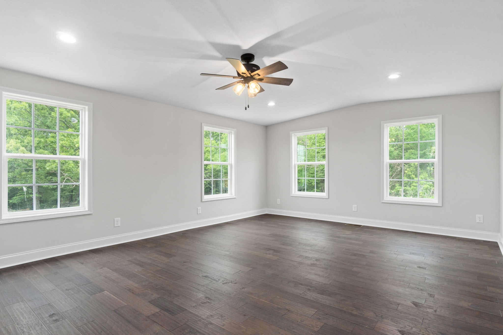 4366 Old Metal Road Palmyra, TN 37142 - Photo 22 of 43 a view of an empty room with wooden floor and a window