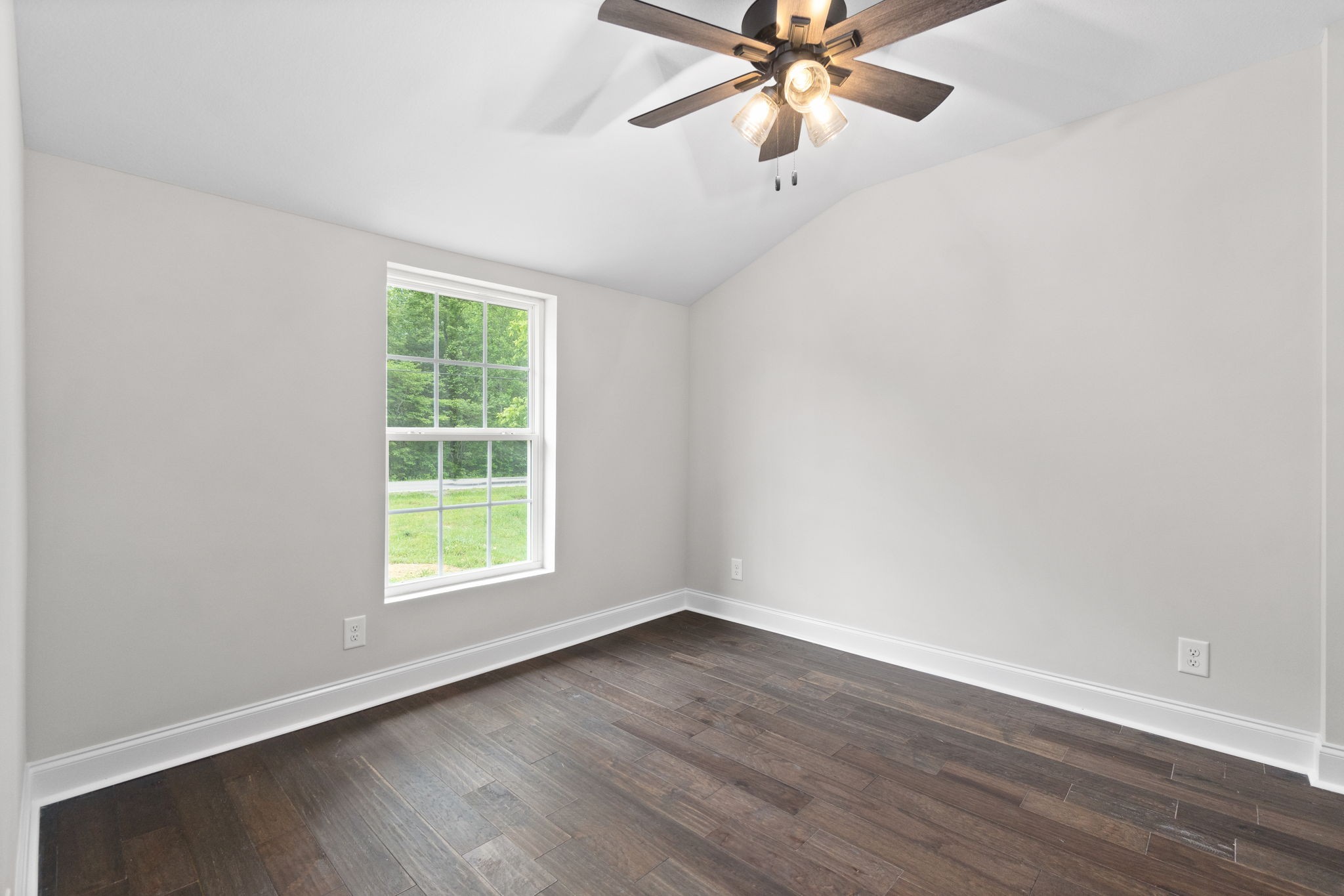 4366 Old Metal Road Palmyra, TN 37142 - Photo 30 of 43 an empty room with wooden floor fan and windows