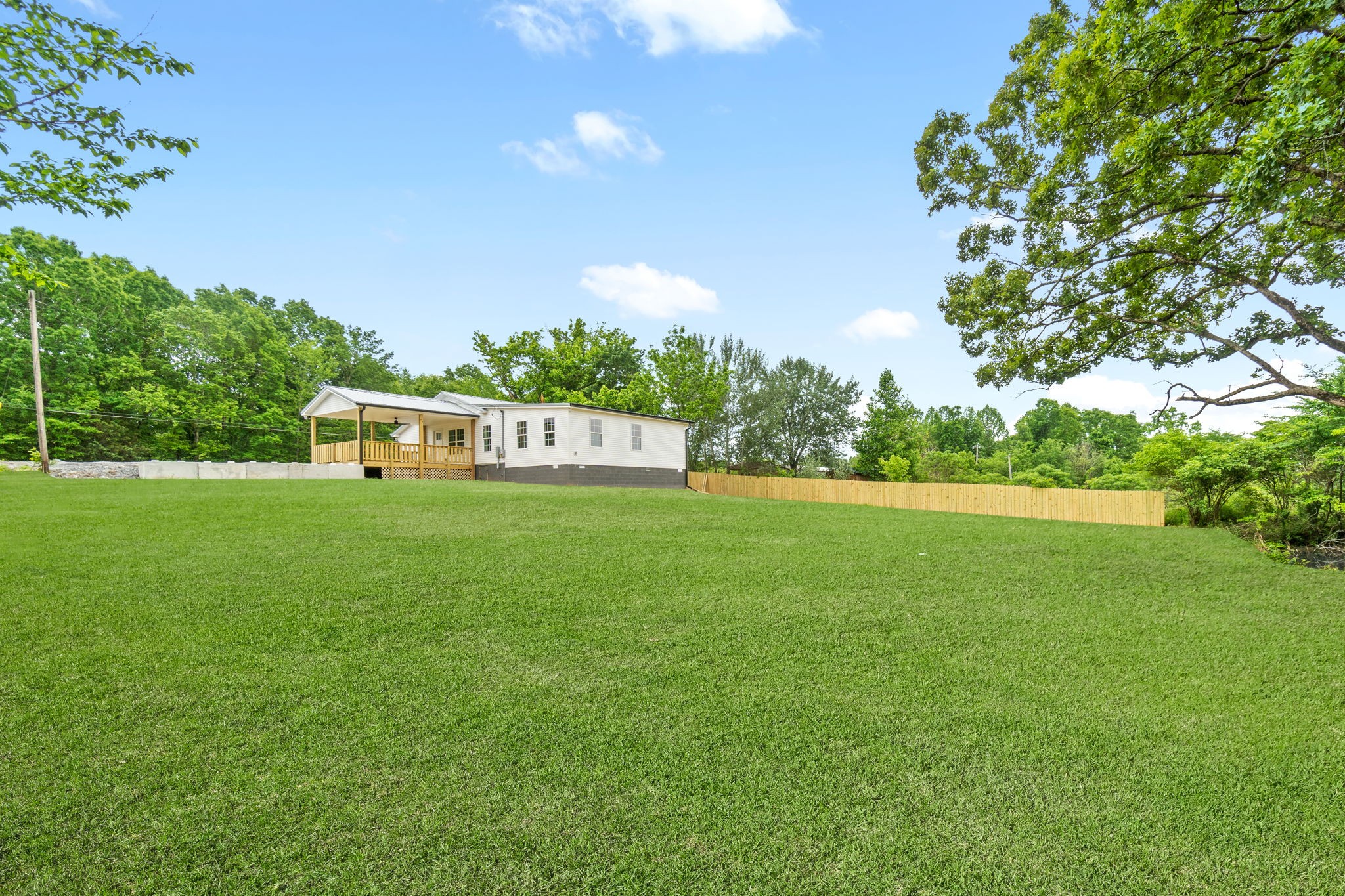 4366 Old Metal Road Palmyra, TN 37142 - Photo 38 of 43 a green field with trees in the background