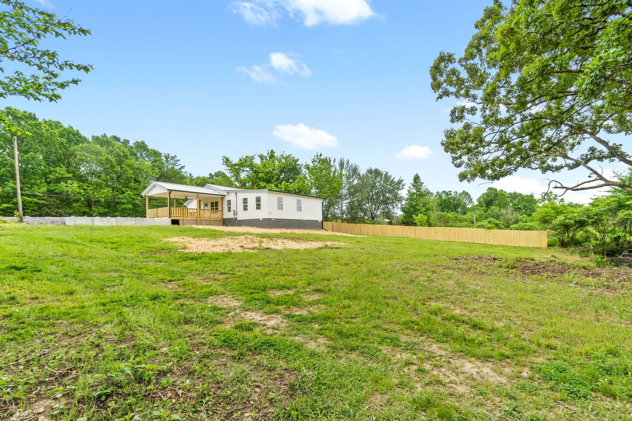 4366 Old Metal Road Palmyra, TN 37142 - Photo 39 of 43 a view of a green field with wooden fence