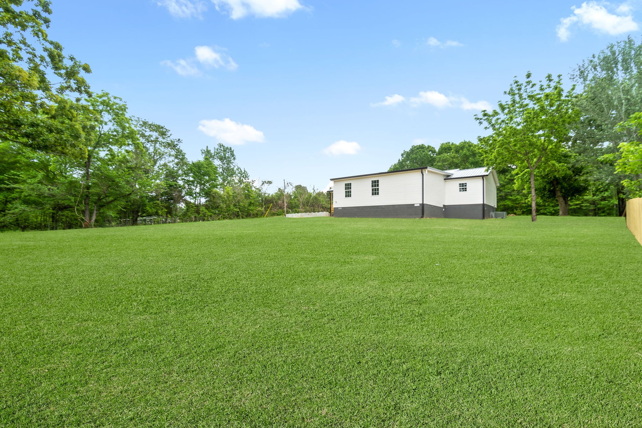 4366 Old Metal Road Palmyra, TN 37142 - Photo 40 of 43 a view of a house with a big yard