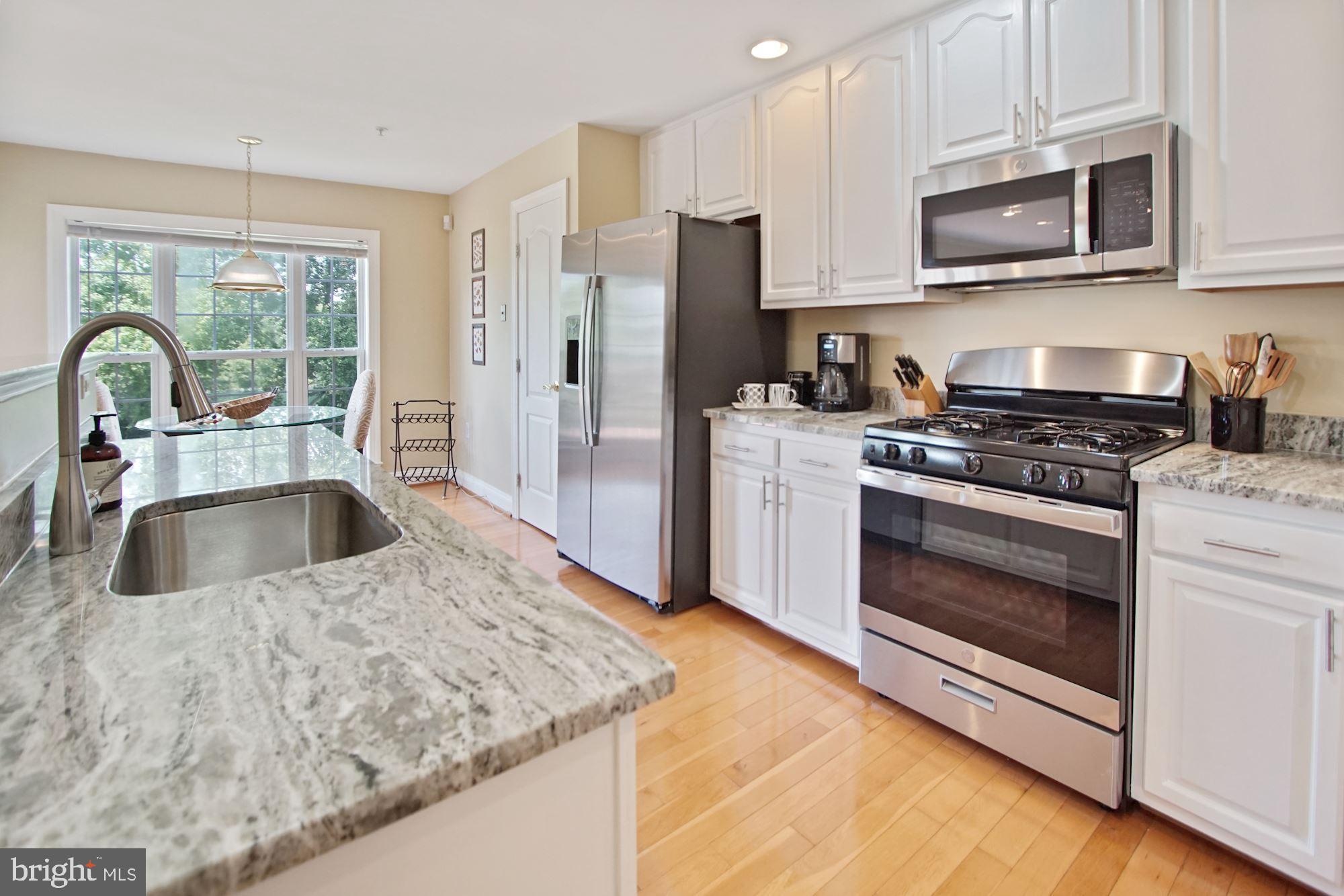 12613 Spriggs Request Court Bowie, MD 20721 - Photo 21 of 48 Kitchen w/hardwood floors