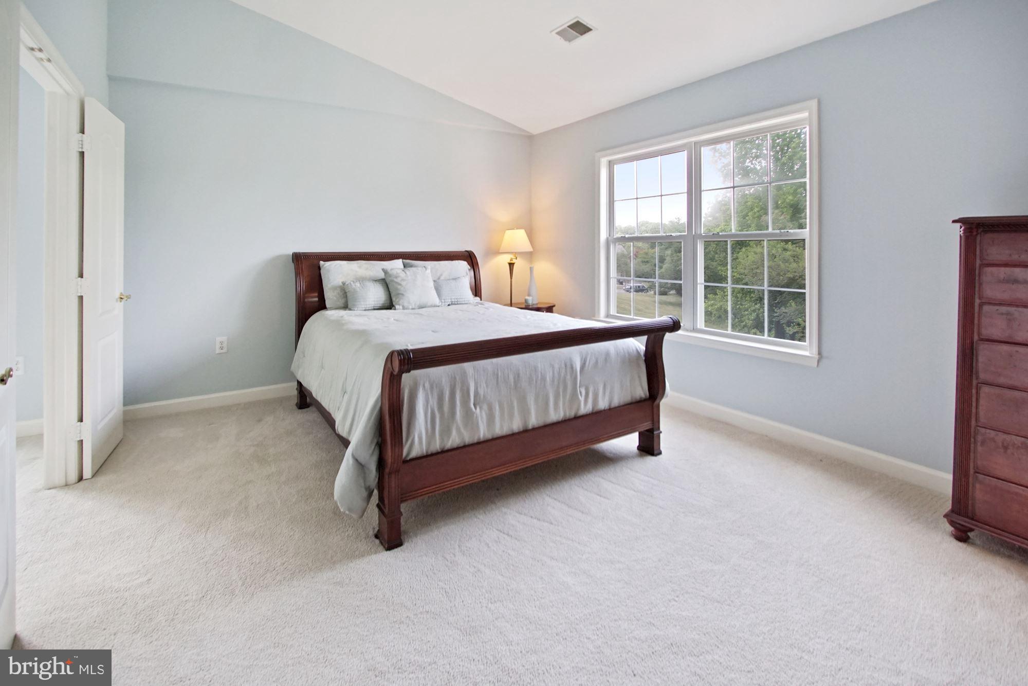 12613 Spriggs Request Court Bowie, MD 20721 - Photo 26 of 48 Primary suite with windows looking out at the lake