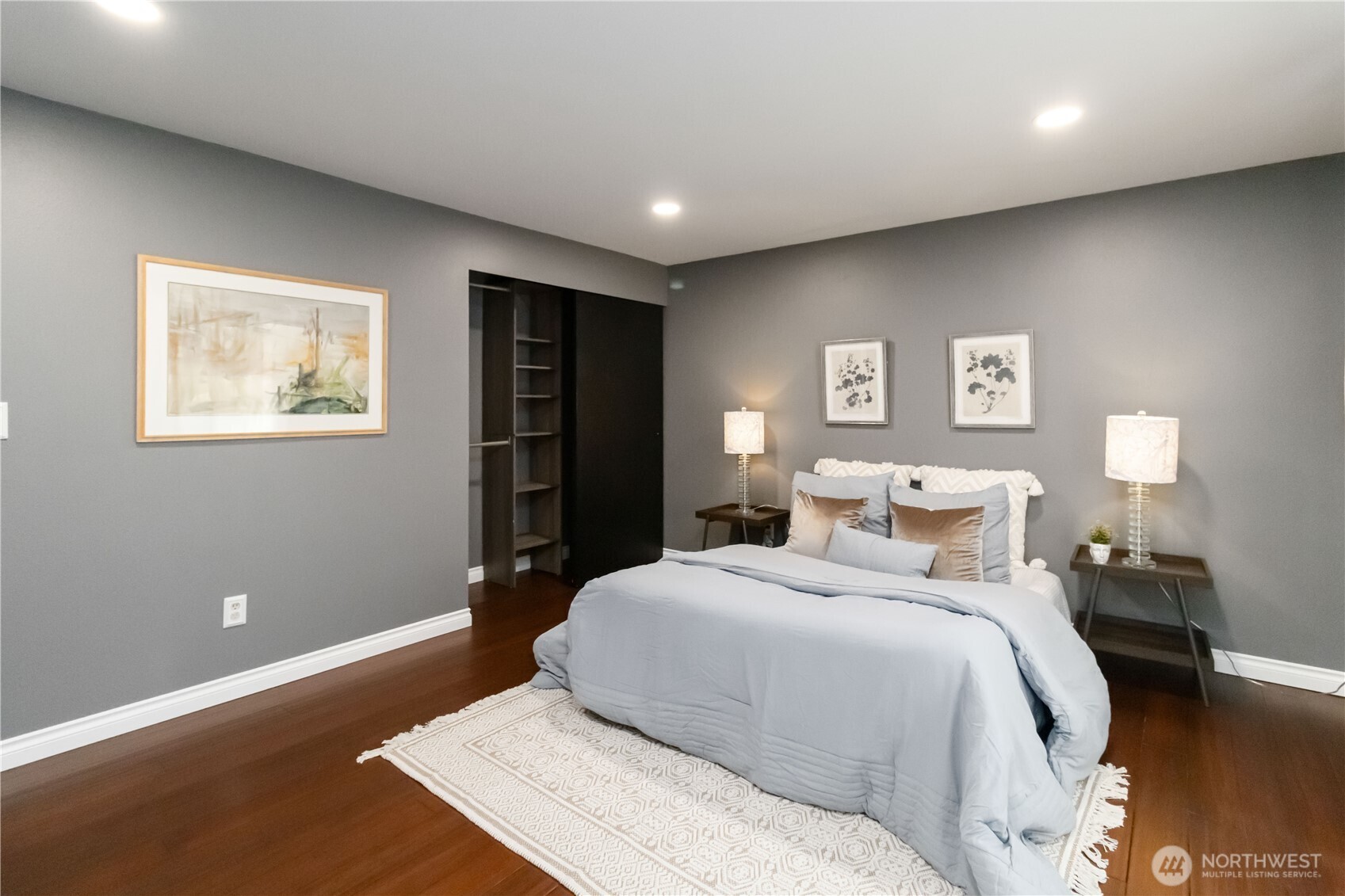 10621 Northeast 147th Street Bothell, WA 98011 - Photo 14 of 36 a bedroom with a bed and a painting