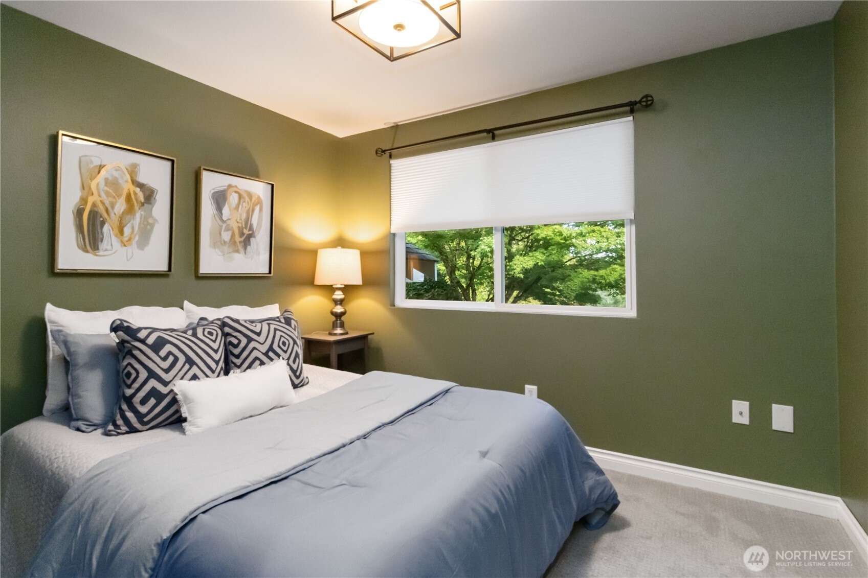 10621 Northeast 147th Street Bothell, WA 98011 - Photo 15 of 36 a bedroom with a bed and a window