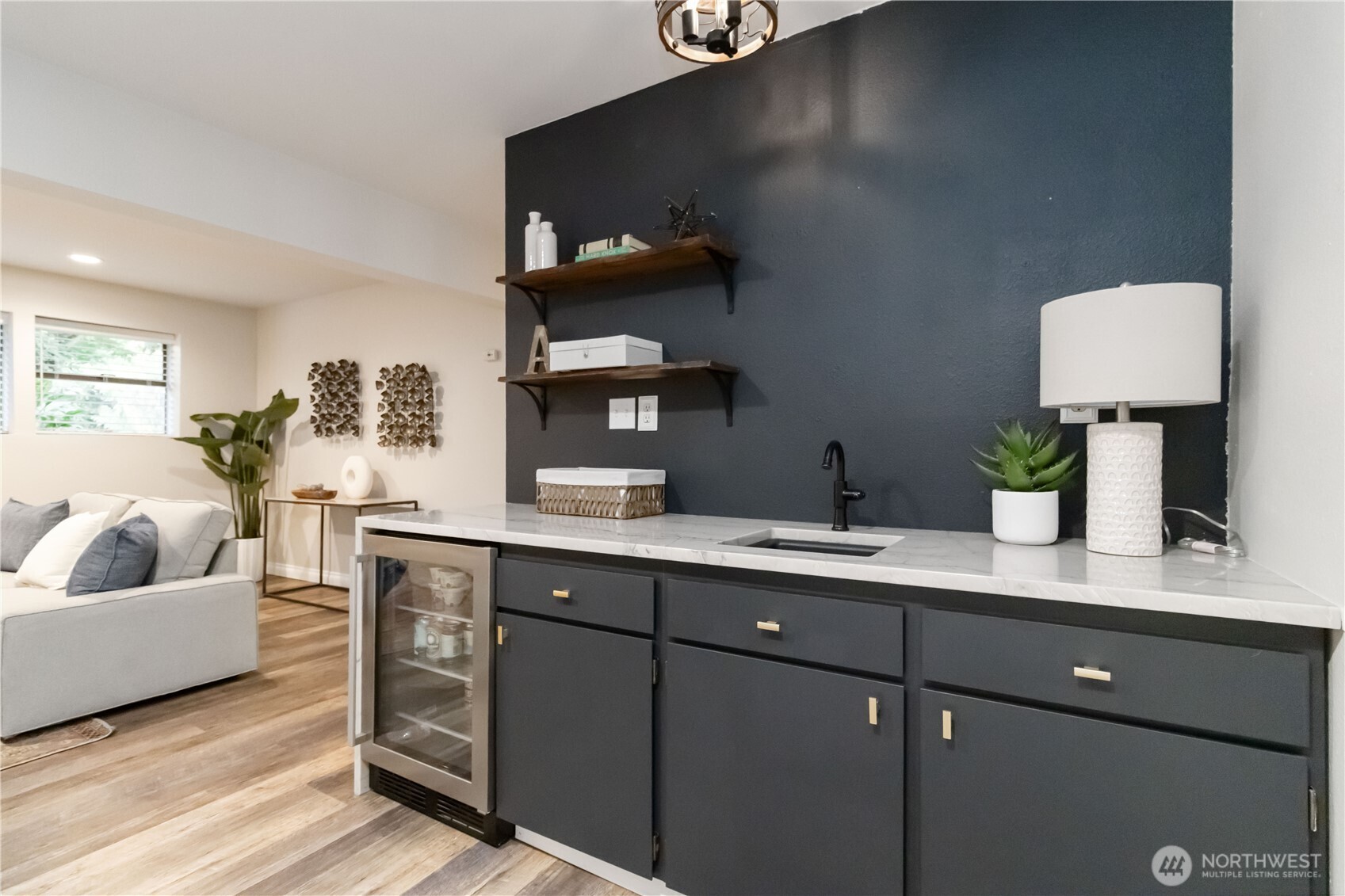 10621 Northeast 147th Street Bothell, WA 98011 - Photo 20 of 36 a living room with furniture and a lamp