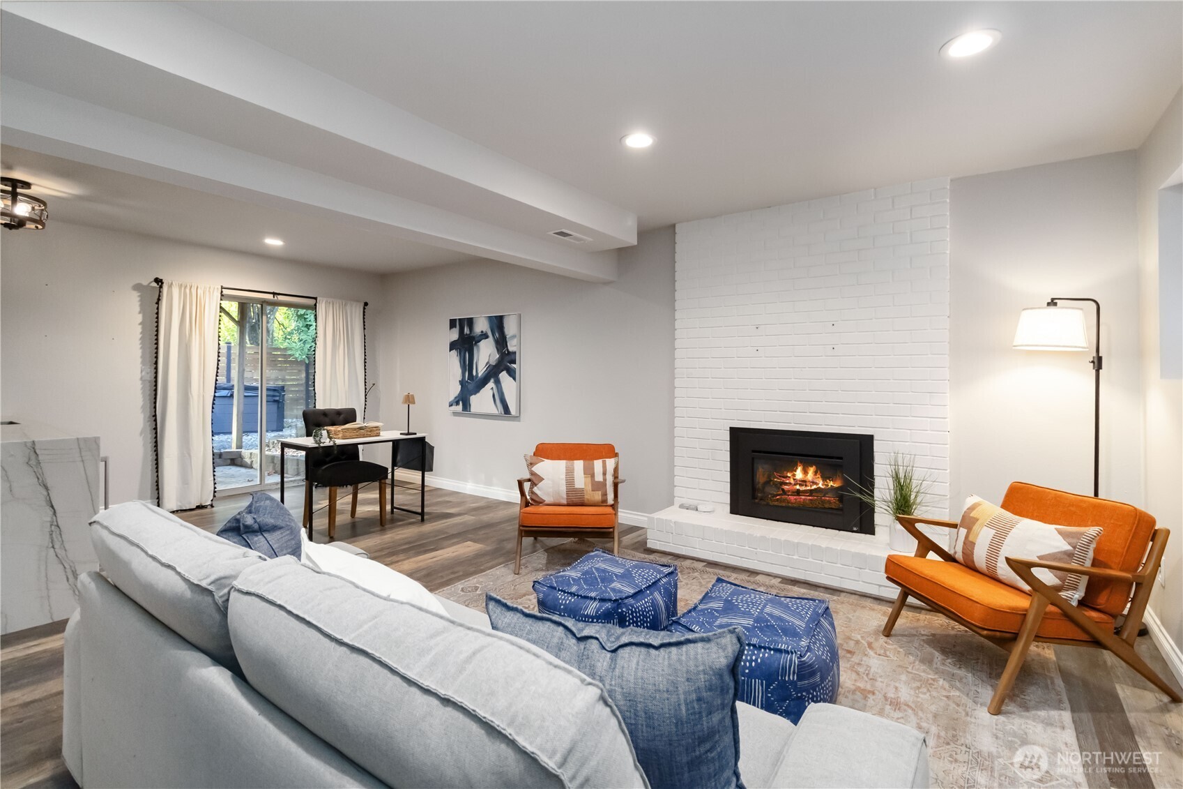 10621 Northeast 147th Street Bothell, WA 98011 - Photo 22 of 36 a living room with furniture and a fireplace