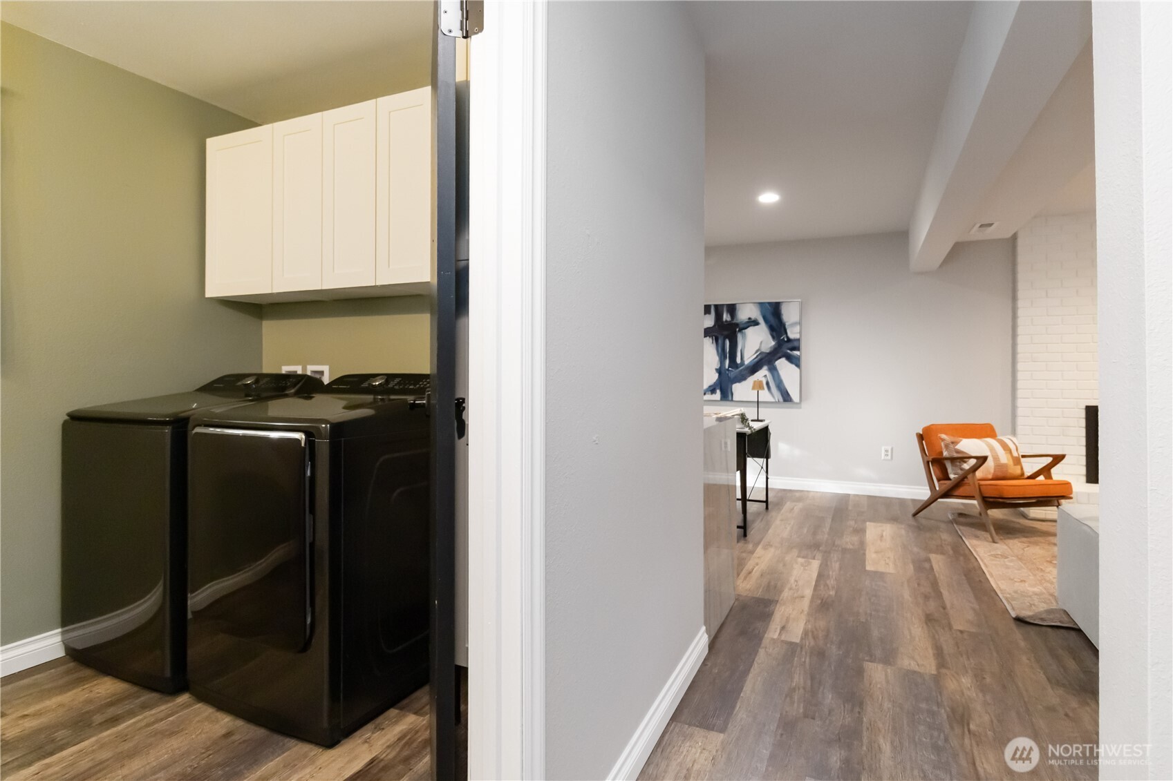 10621 Northeast 147th Street Bothell, WA 98011 - Photo 24 of 36 a hallway with a view of living room