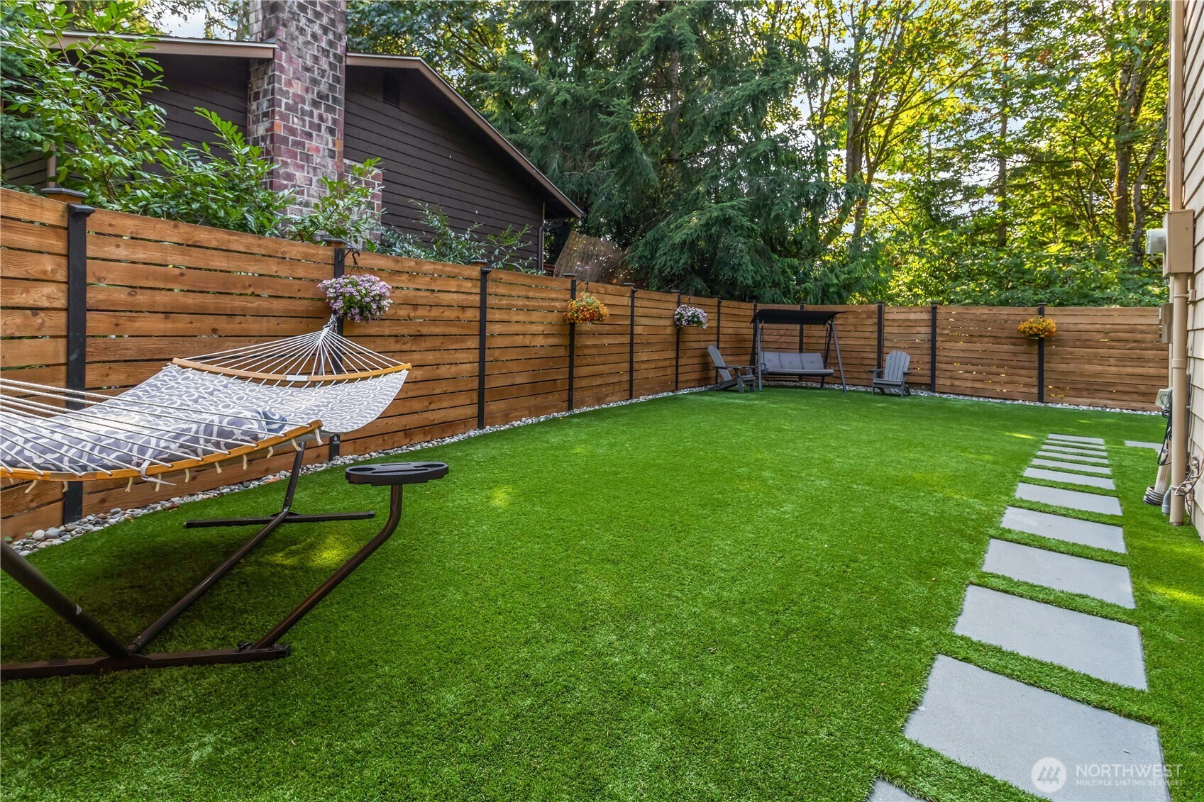 10621 Northeast 147th Street Bothell, WA 98011 - Photo 29 of 36 a view of a backyard with a small cabin