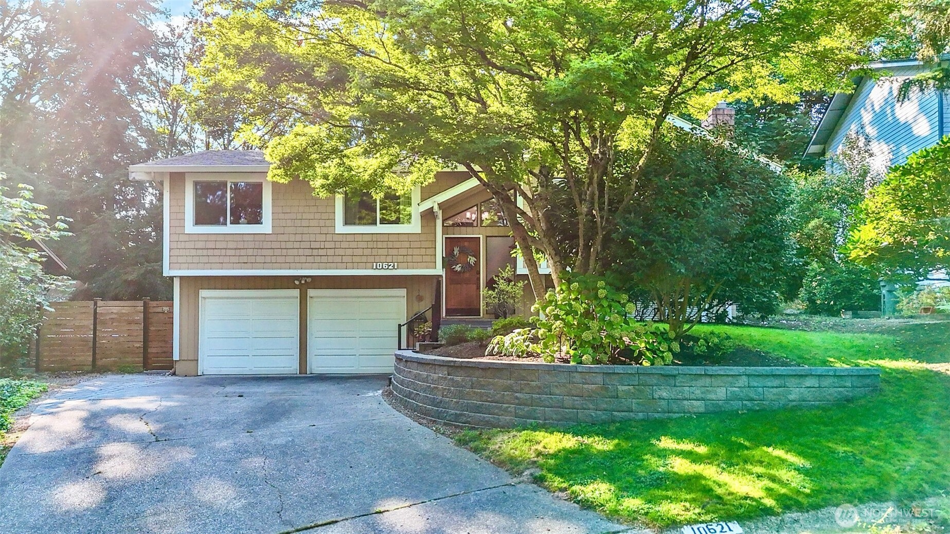 10621 Northeast 147th Street Bothell, WA 98011 - Photo 3 of 36 a front view of a house with a yard