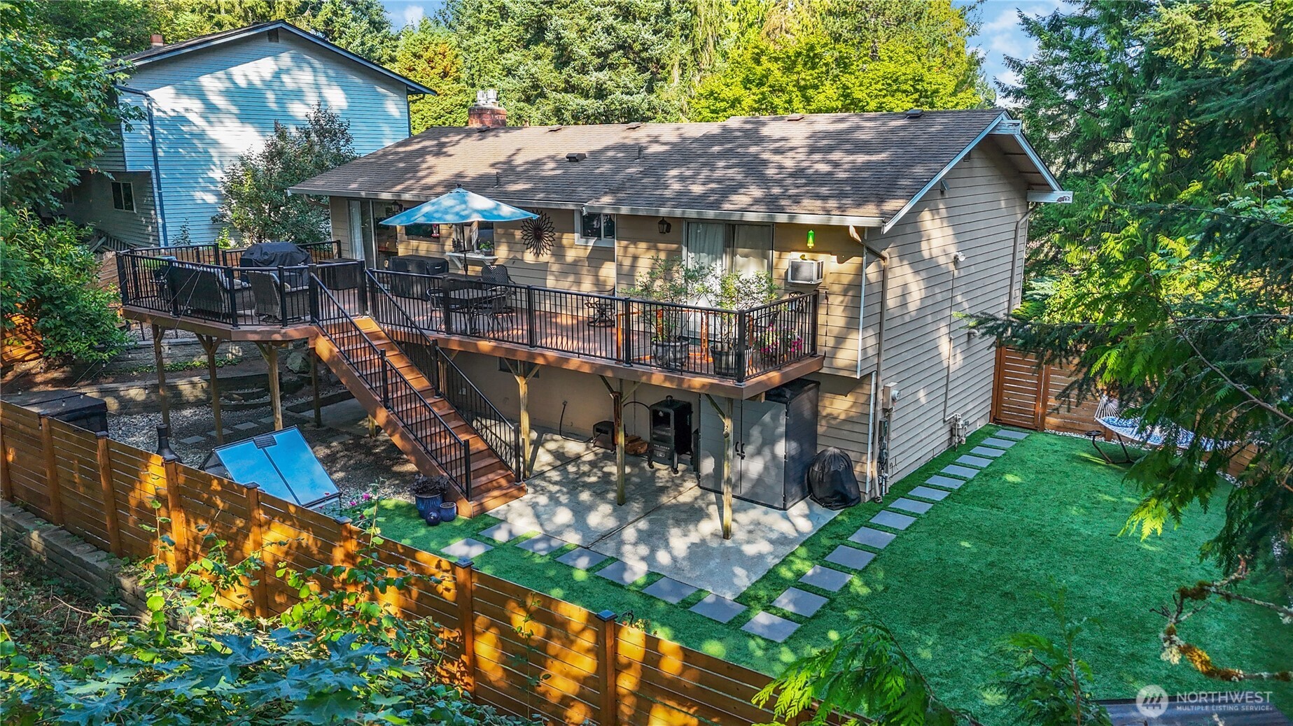 10621 Northeast 147th Street Bothell, WA 98011 - Photo 32 of 36 a small garden area with wooden fence
