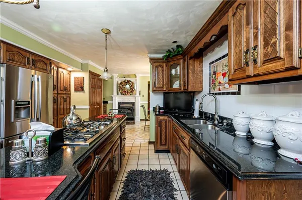 a kitchen with lots of counter top space stove and cabinets