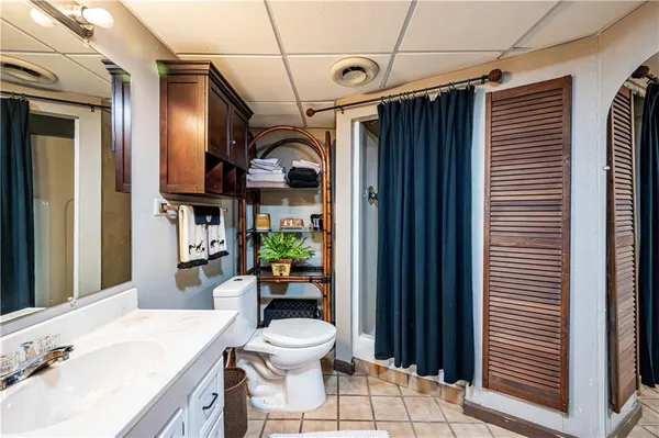 a bed room with a bed and a tv