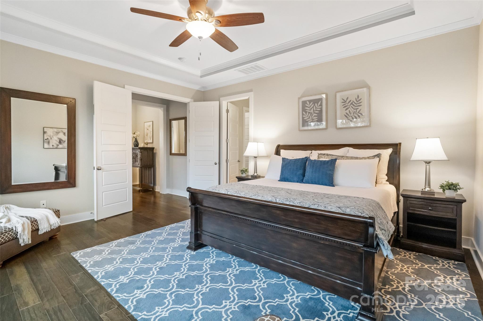 1953 Masons Bend Drive Fort Mill, SC 29708 - Photo 13 of 40 a bedroom with a bed and a chandelier