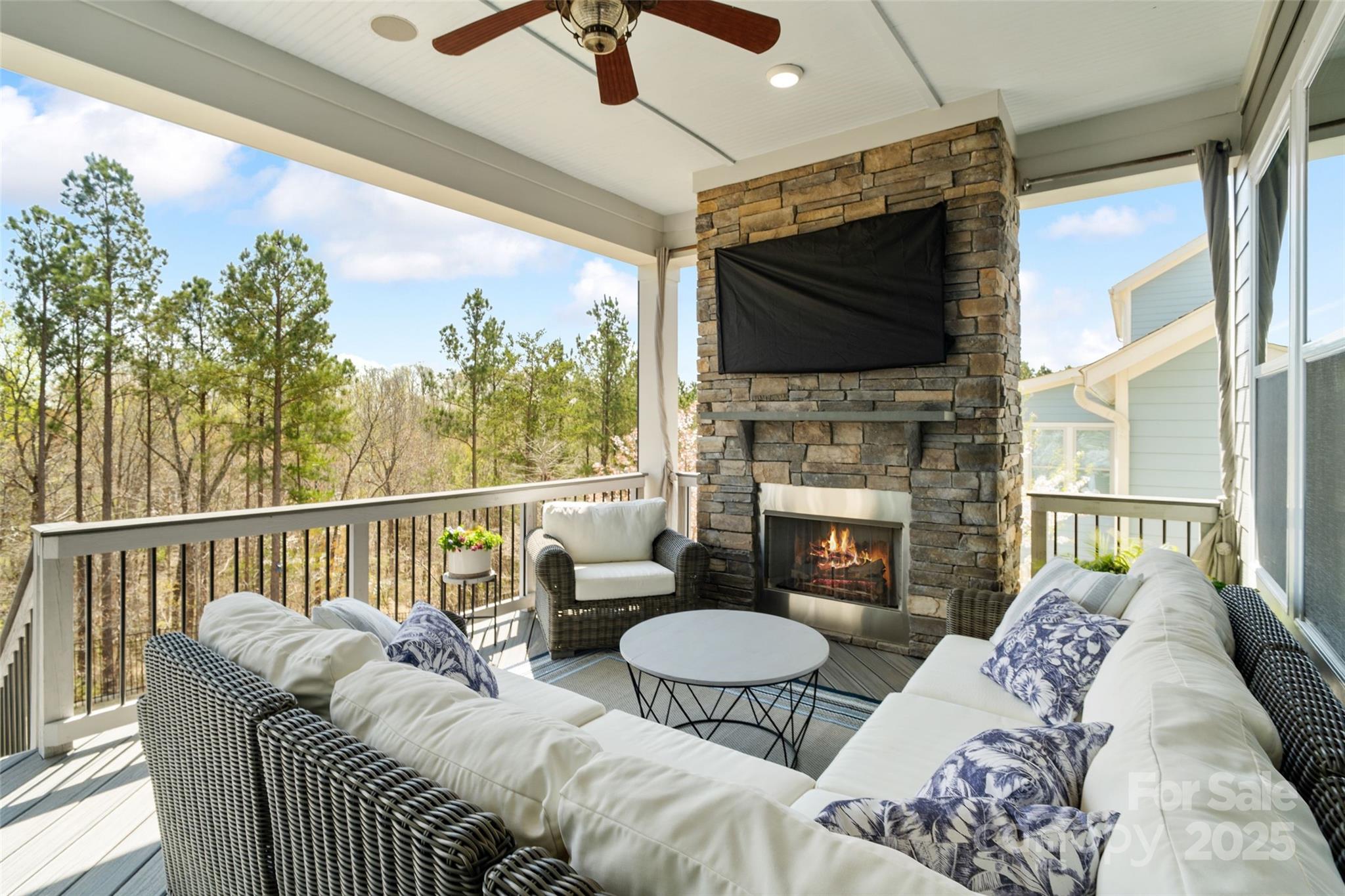 1953 Masons Bend Drive Fort Mill, SC 29708 - Photo 31 of 40 a living room with furniture a flat screen tv and a fireplace