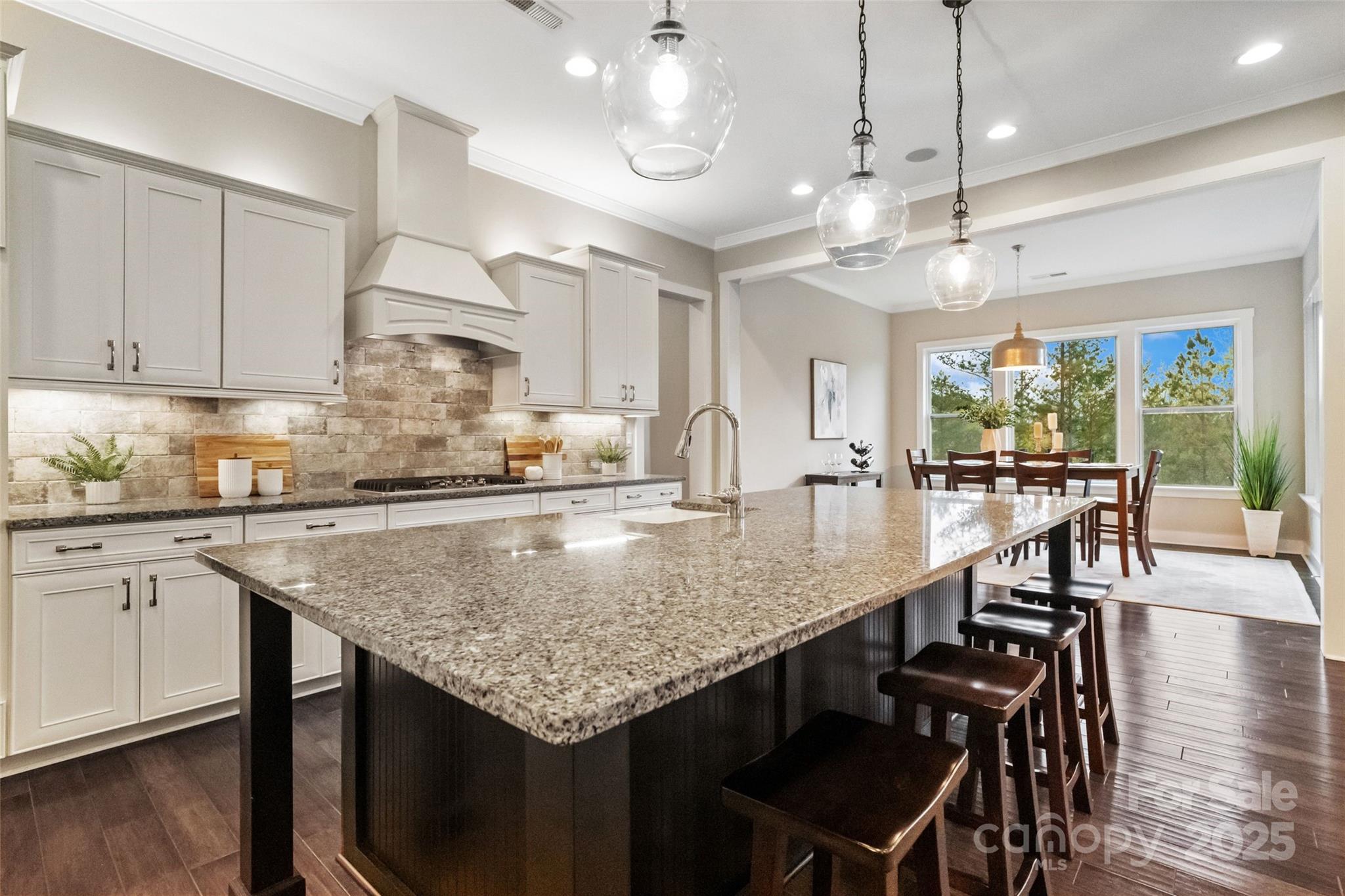 1953 Masons Bend Drive Fort Mill, SC 29708 - Photo 10 of 40 a kitchen with granite countertop center island and stainless steel appliances
